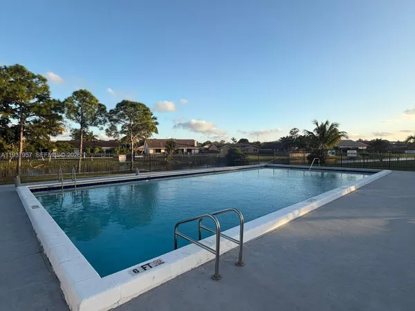 a view of a swimming pool and outdoor space
