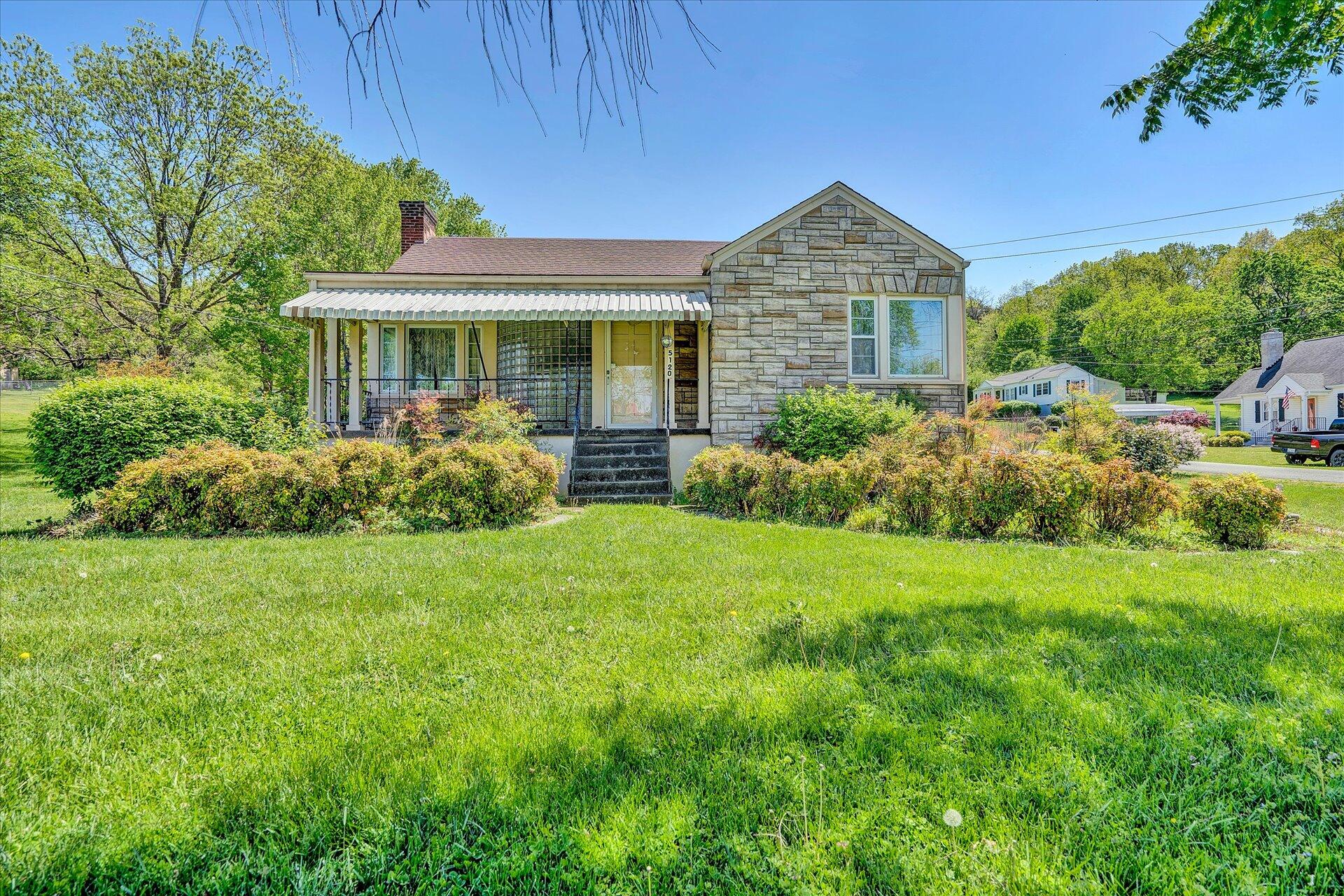 5120 Starkey Road Roanoke, VA 24018 - Photo 1 of 17 a front view of a house with garden