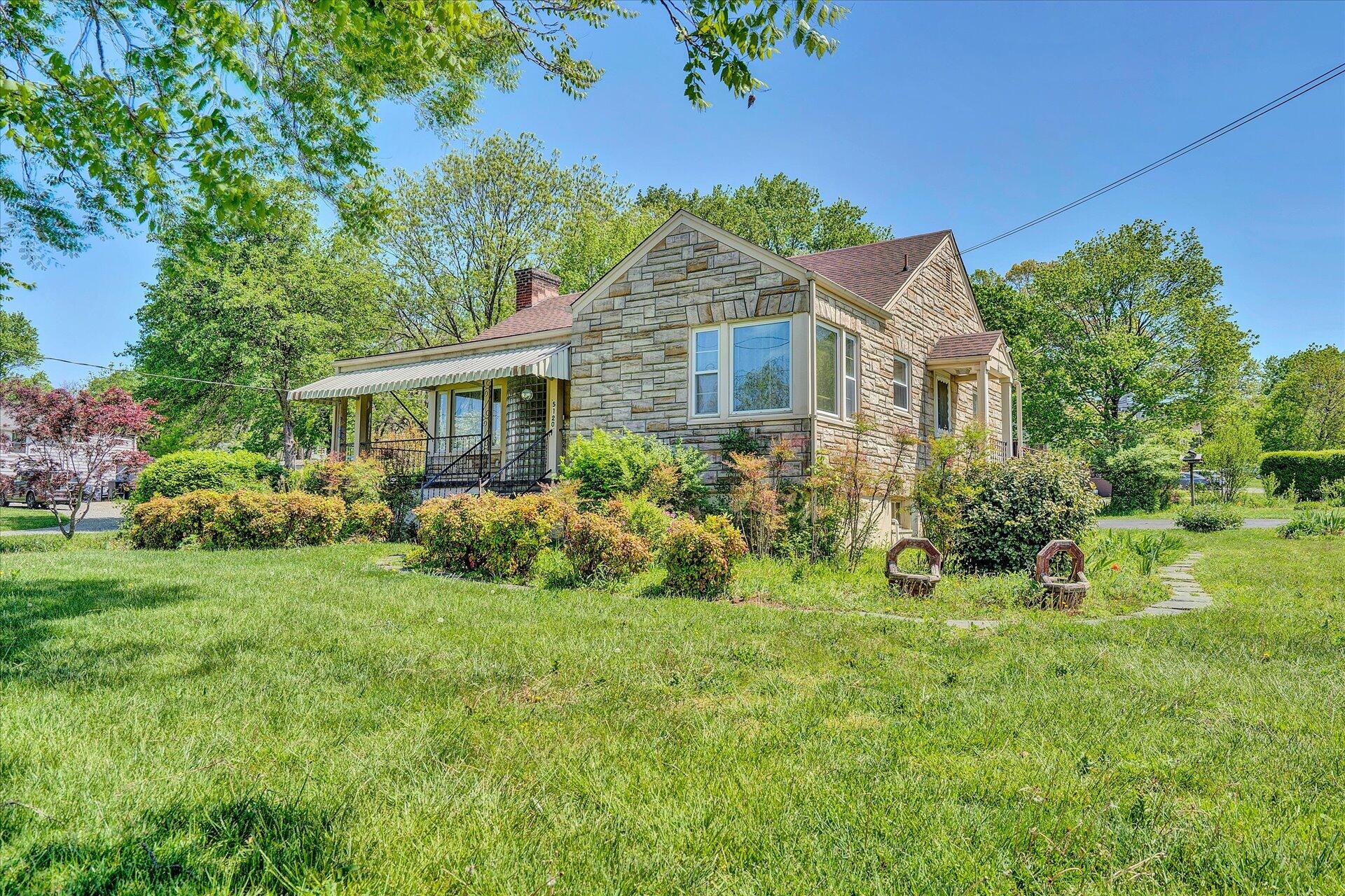 5120 Starkey Road Roanoke, VA 24018 - Photo 2 of 17 a front view of a house with a yard