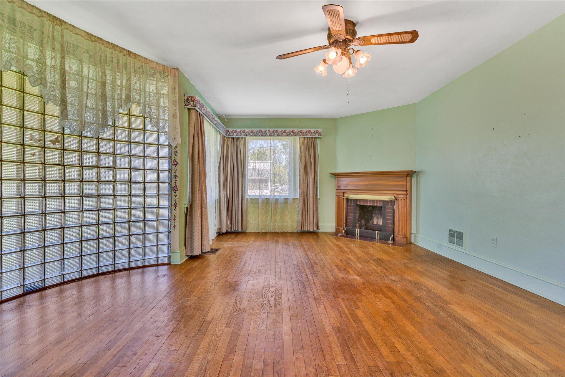 5120 Starkey Road Roanoke, VA 24018 - Photo 3 of 17 a view of an empty room with window and wooden floor