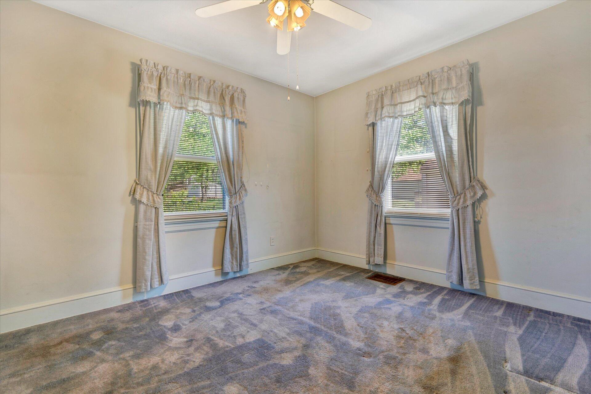 5120 Starkey Road Roanoke, VA 24018 - Photo 8 of 17 an empty room with windows and outdoor view
