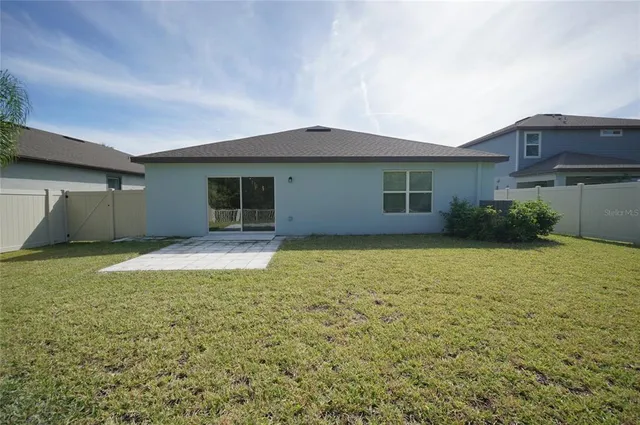 a view of a lobby with chair and a potted plant