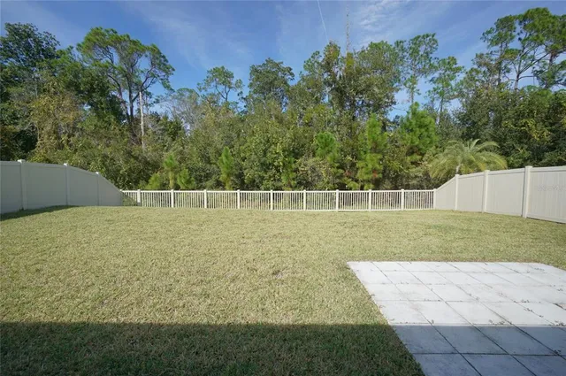 a view of swimming pool with sitting area