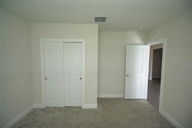 a bathroom with a sink a toilet and a shower