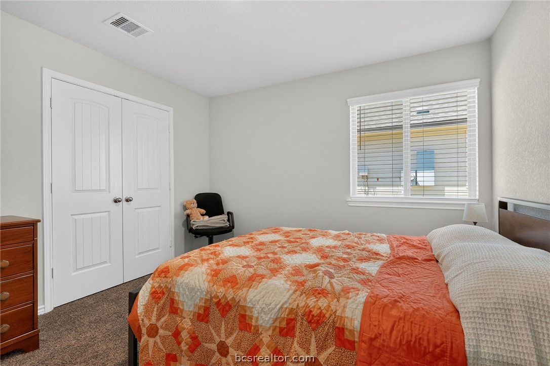 5235 Montague Loop Bryan, TX 77807 - Photo 13 of 25 a bedroom with a bed and with furniture