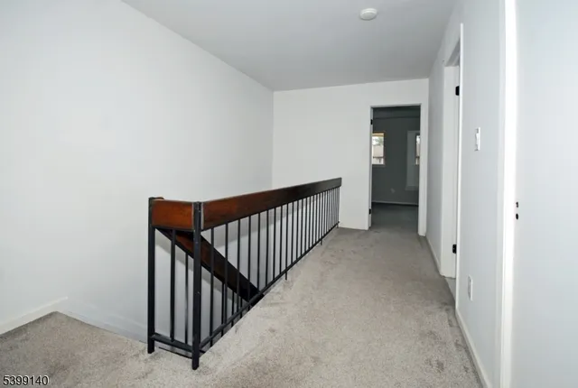 a spacious bedroom with a bed and a window