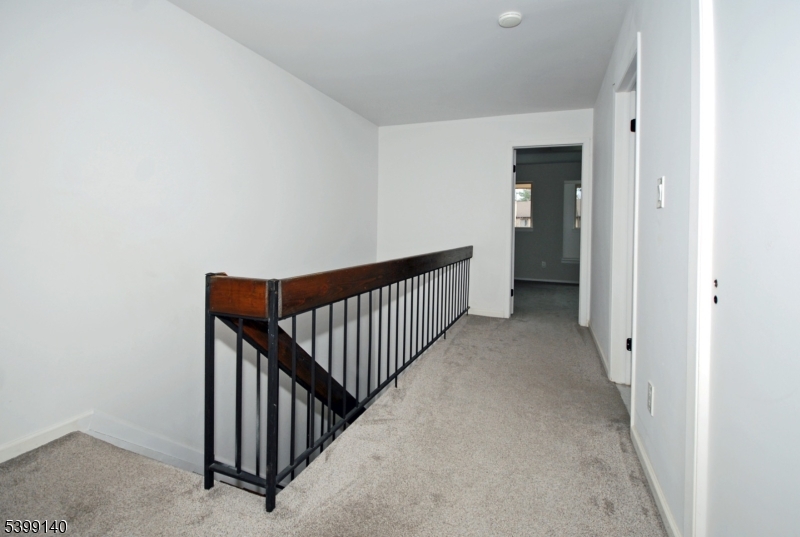 102 Chelsea Way Bridgewater, NJ 08807 - Photo 14 of 28 a view of a hallway with wooden floor and entryway
