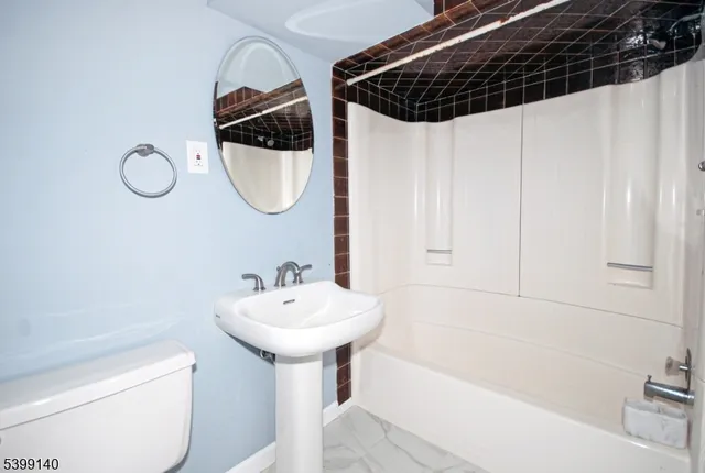 a view of an empty room with stairs