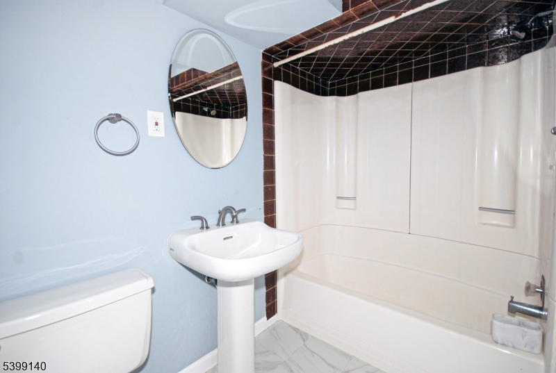 102 Chelsea Way Bridgewater, NJ 08807 - Photo 22 of 28 a bathroom with a sink a toilet and shower