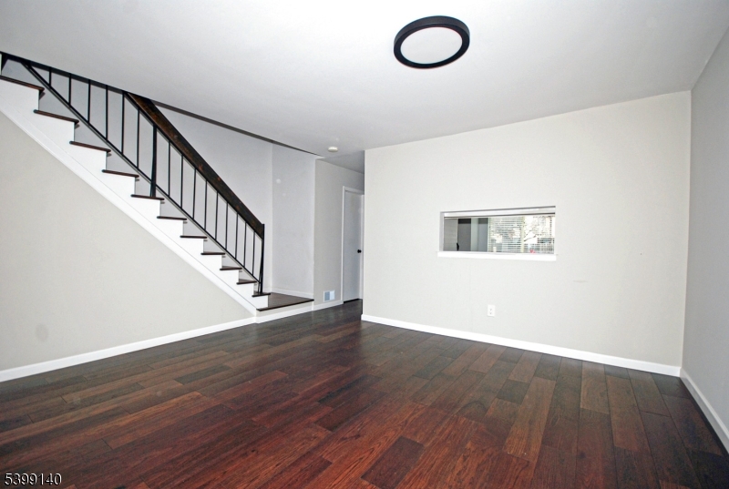 102 Chelsea Way Bridgewater, NJ 08807 - Photo 7 of 28 a view of a room with wooden floor and staircase