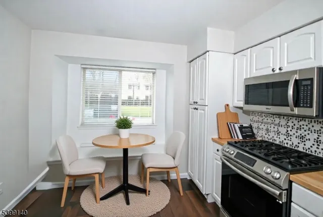 a kitchen with a stove and a microwave