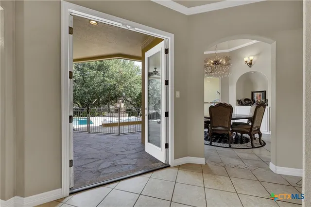a view of a hallway with living room and dining room view