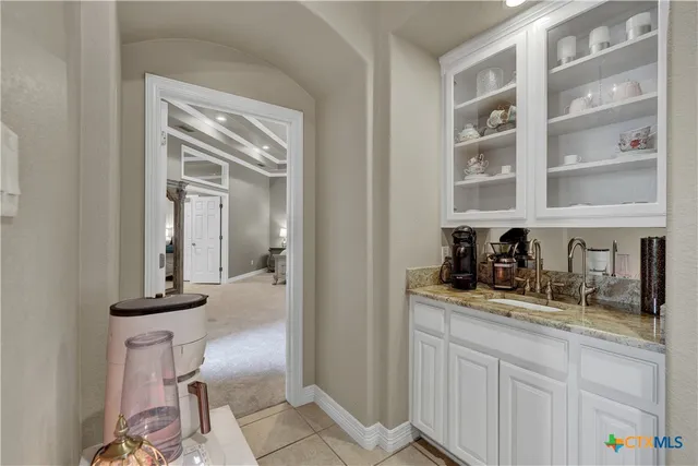 a kitchen with cabinets and window