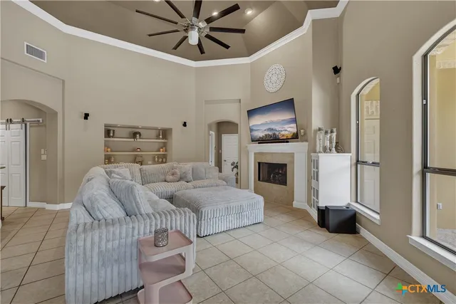 a living room with furniture and a fireplace