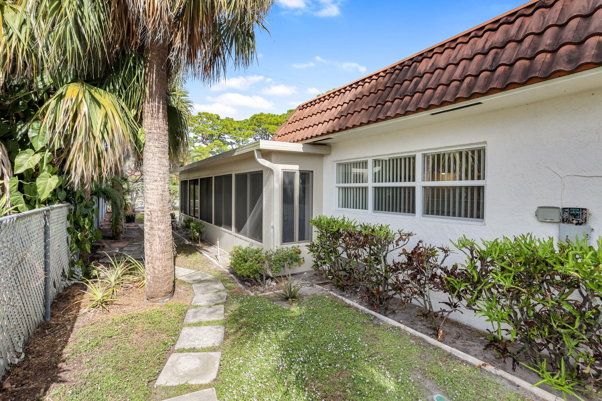 89 Lariat Circle Boca Raton, FL 33487 - Photo 30 of 31 a front view of a house with a garden