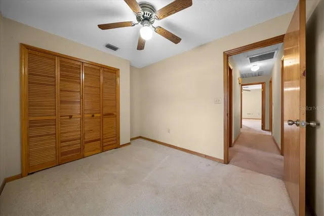 an aerial view of a houses with a yard