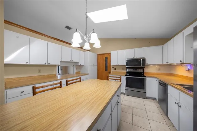 a view of a livingroom with a ceiling fan and window