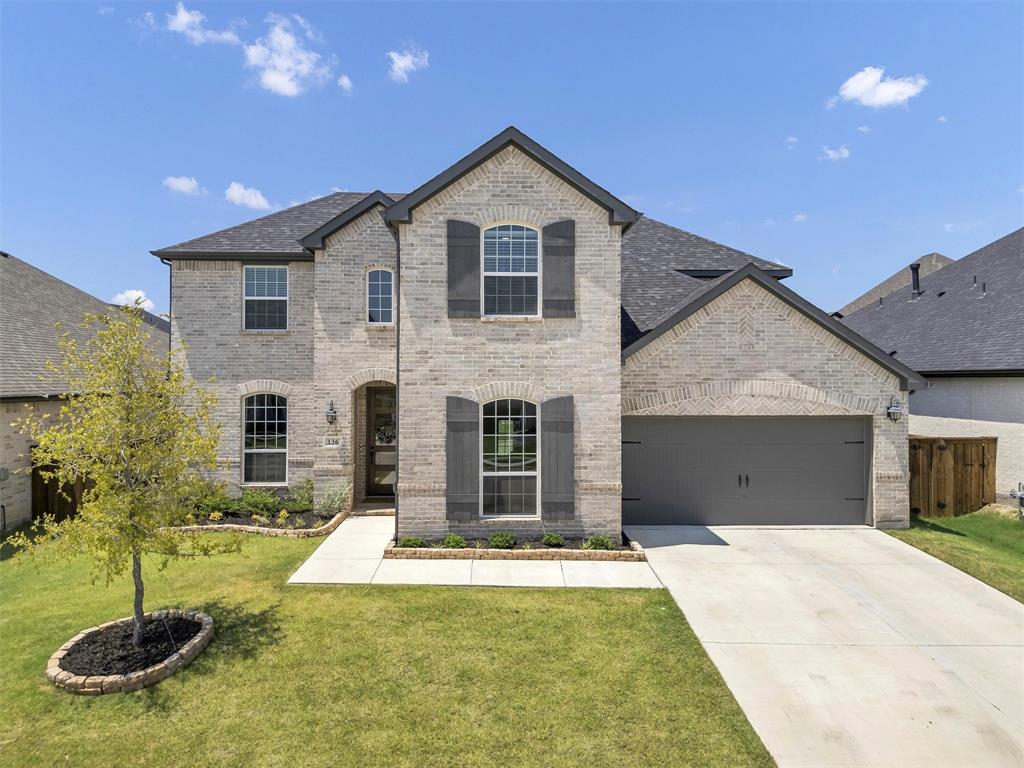 a front view of a house with yard