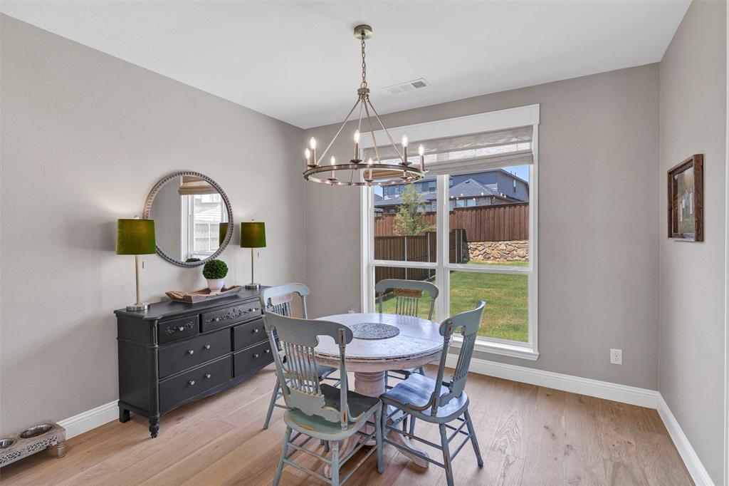 136 Derrett Lane Rhome, TX 76078 - Photo 14 of 40 a view of a dining room with furniture window and wooden floor