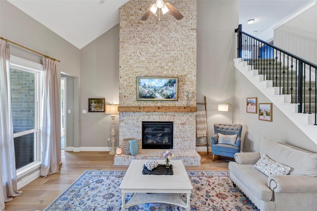 136 Derrett Lane Rhome, TX 76078 - Photo 16 of 40 a living room with furniture and a fireplace