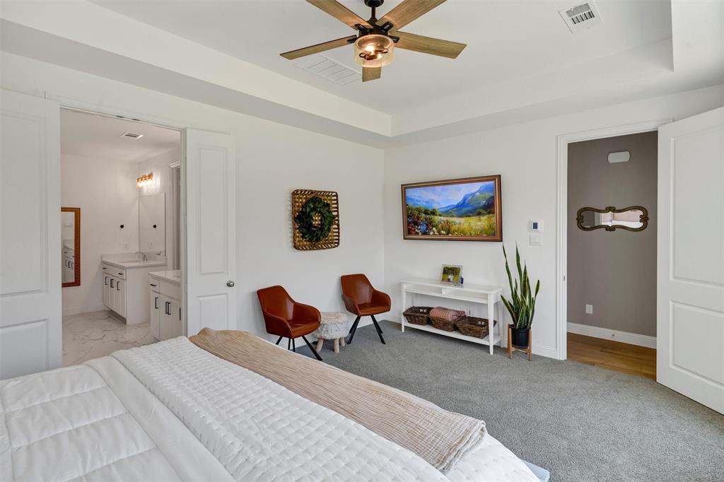 136 Derrett Lane Rhome, TX 76078 - Photo 19 of 40 a bedroom with furniture and window