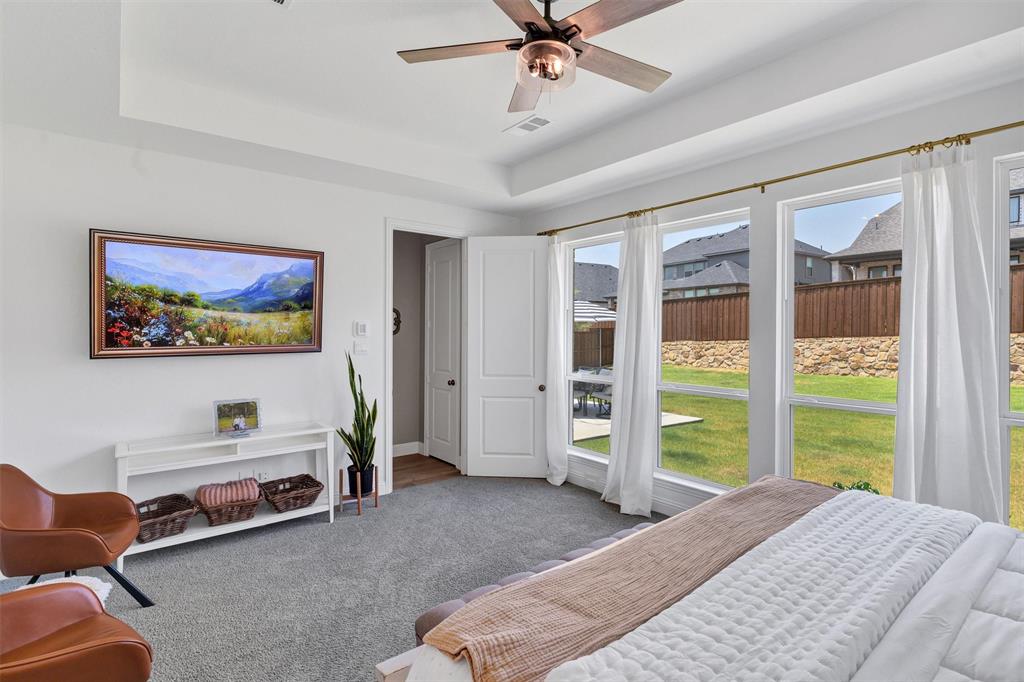 136 Derrett Lane Rhome, TX 76078 - Photo 20 of 40 a bedroom with a bed and a large window