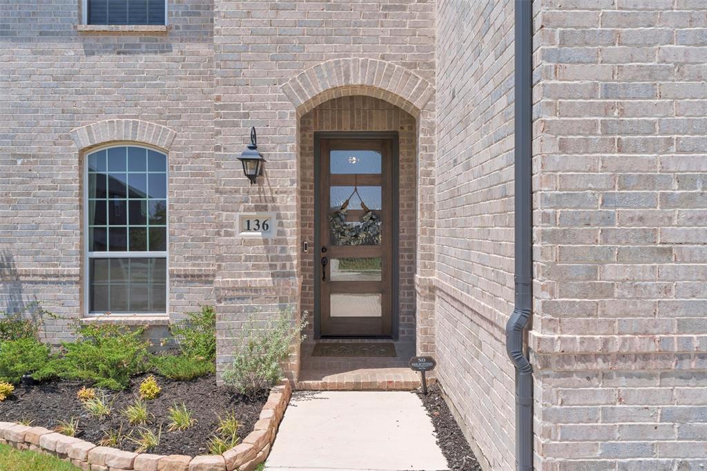 136 Derrett Lane Rhome, TX 76078 - Photo 2 of 40 a front view of a house with a yard