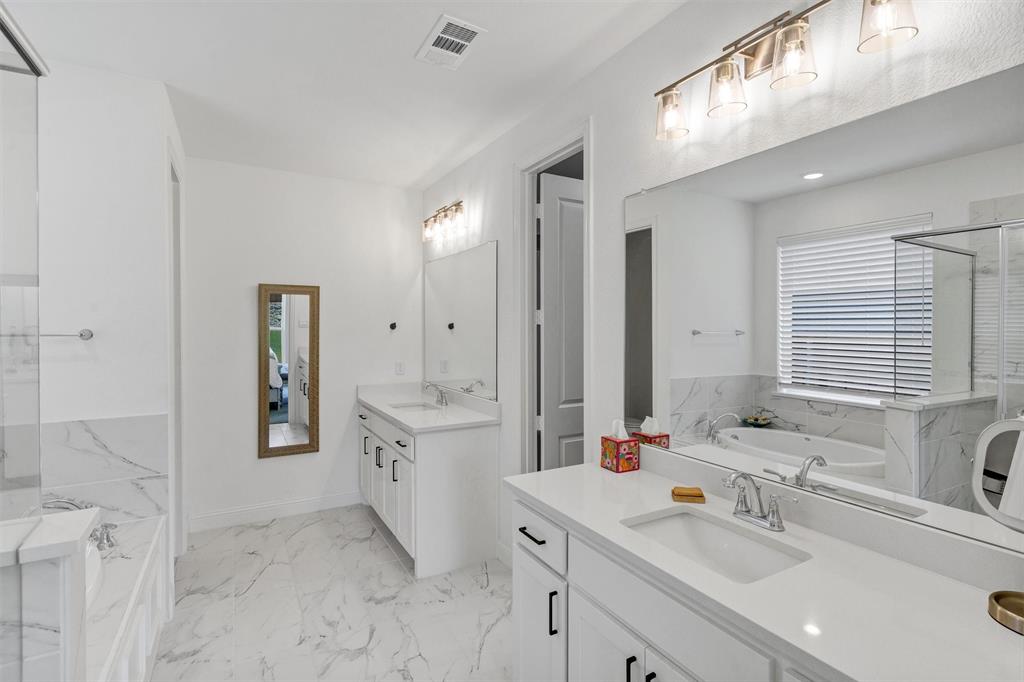 136 Derrett Lane Rhome, TX 76078 - Photo 24 of 40 a bathroom with a double vanity sink mirror and double