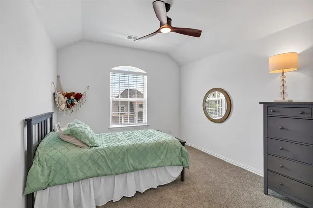 a bathroom with a sink a toilet and shower curtain