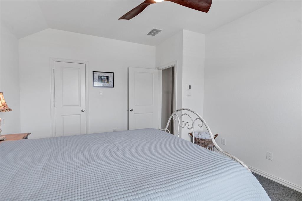 136 Derrett Lane Rhome, TX 76078 - Photo 31 of 40 a bedroom with a bed and a dresser