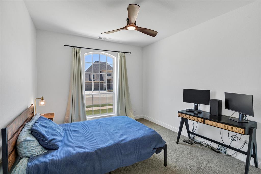 136 Derrett Lane Rhome, TX 76078 - Photo 33 of 40 a bedroom with a bed and a window