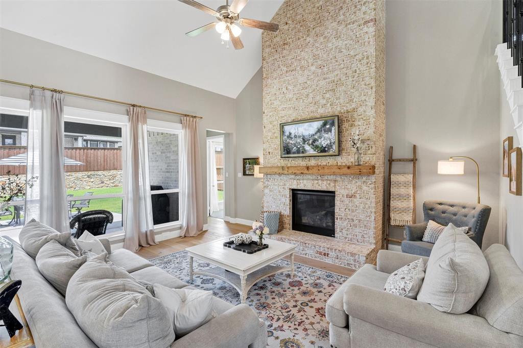 136 Derrett Lane Rhome, TX 76078 - Photo 4 of 40 a living room with furniture and a fireplace