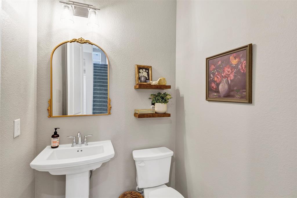 136 Derrett Lane Rhome, TX 76078 - Photo 8 of 40 a bathroom with a sink mirror and toilet