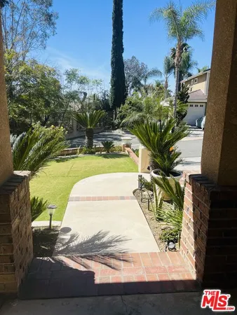 a view of swimming pool with a yard