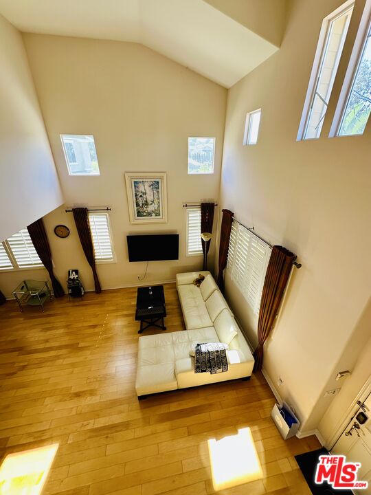 2078 Nohl Ranch Road Orange, CA 92867 - Photo 2 of 3 a living room with furniture and a flat screen tv