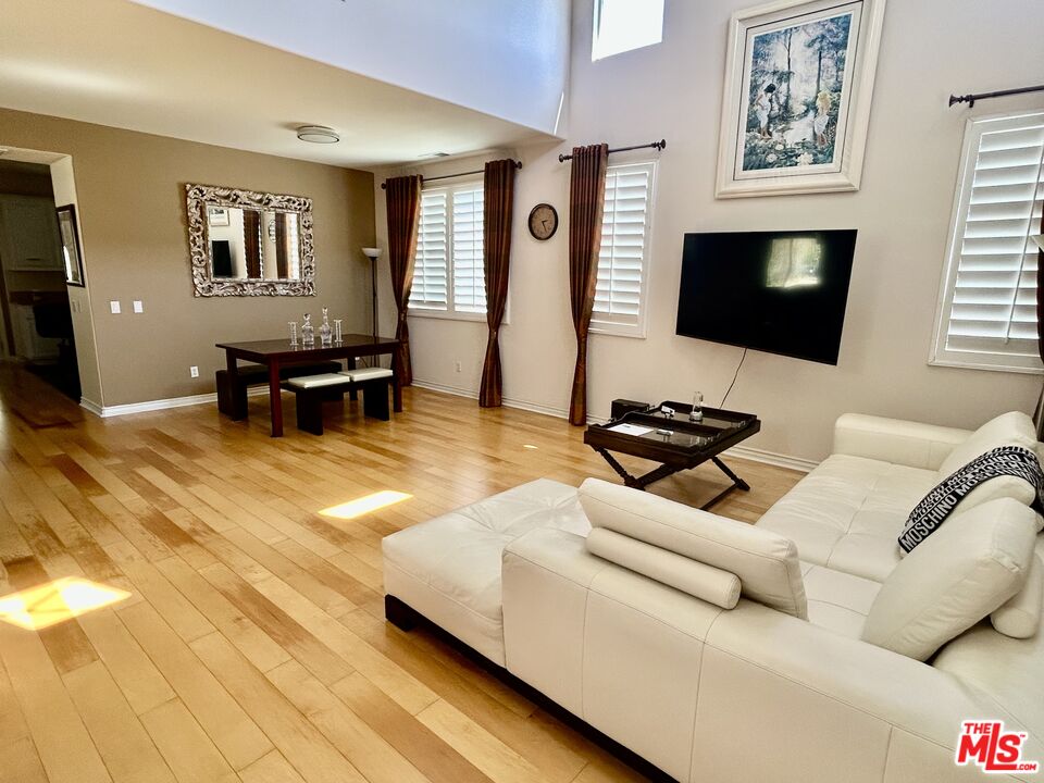 2078 Nohl Ranch Road Orange, CA 92867 - Photo 3 of 13 a living room with furniture and a flat screen tv