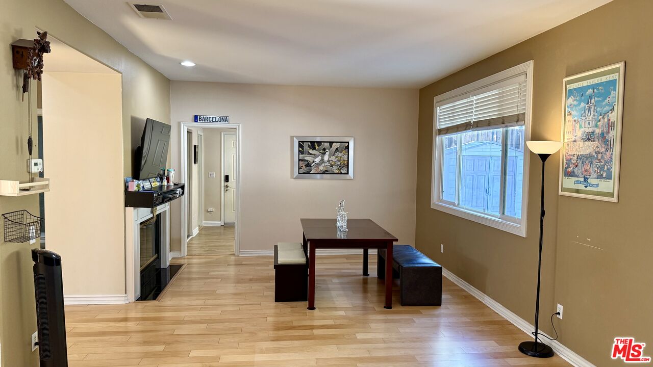2078 Nohl Ranch Road Orange, CA 92867 - Photo 9 of 13 a living room with furniture and a wooden floor