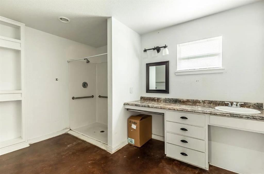1627 North 9th Street Waco, TX 76707 - Photo 7 of 9 a kitchen with a stove and cabinets