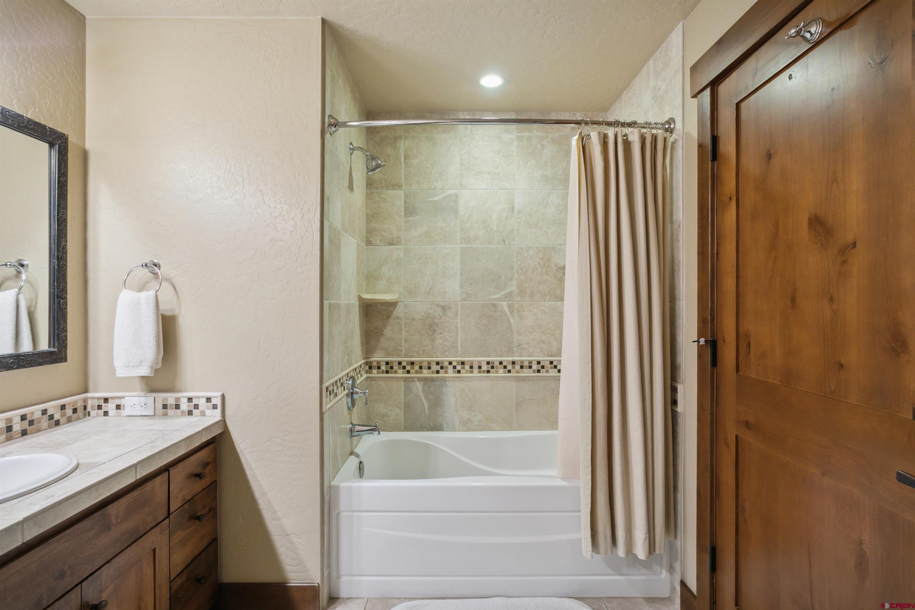 24 Sheol Street, Unit R302 Durango, CO 81301 - Photo 22 of 45 a bathroom with a sink and a bathtub