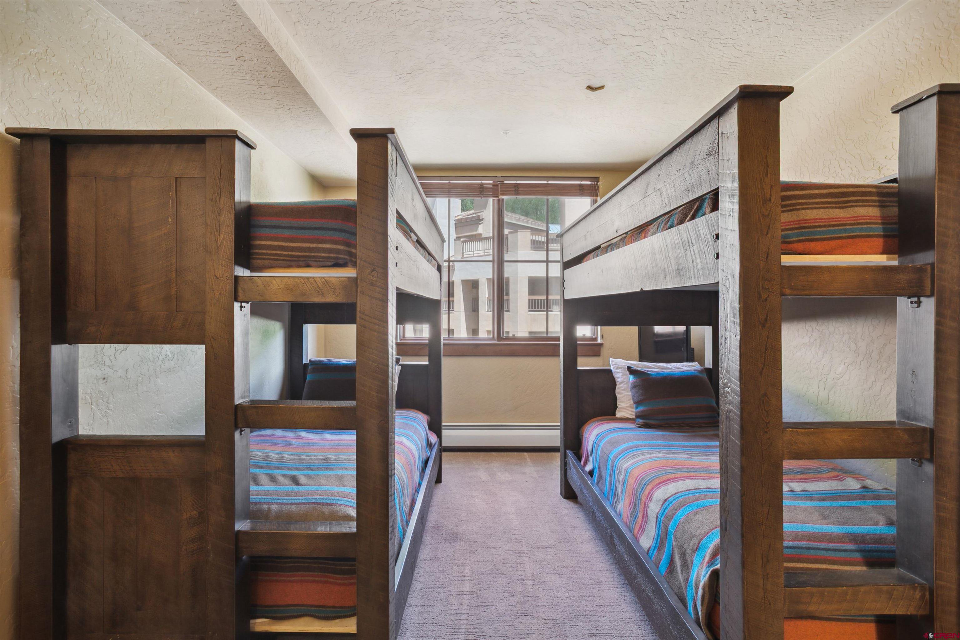 24 Sheol Street, Unit R302 Durango, CO 81301 - Photo 26 of 45 a bedroom with furniture and a window