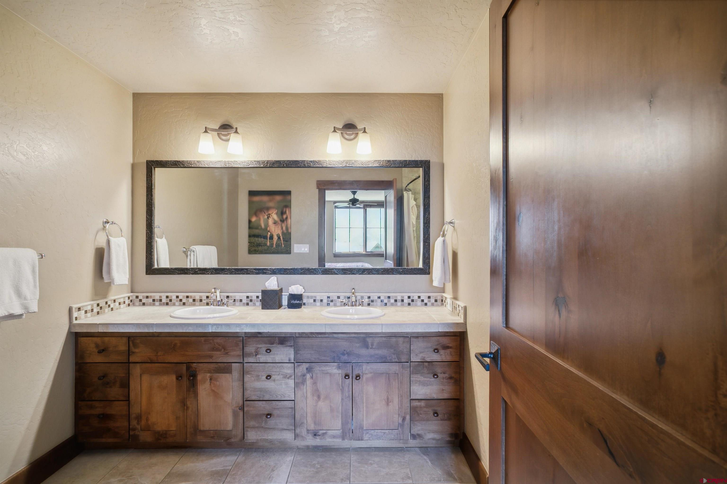 24 Sheol Street, Unit R302 Durango, CO 81301 - Photo 34 of 45 a bathroom with a sink and a mirror