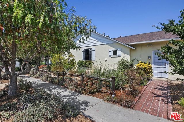 a house with trees in front of it