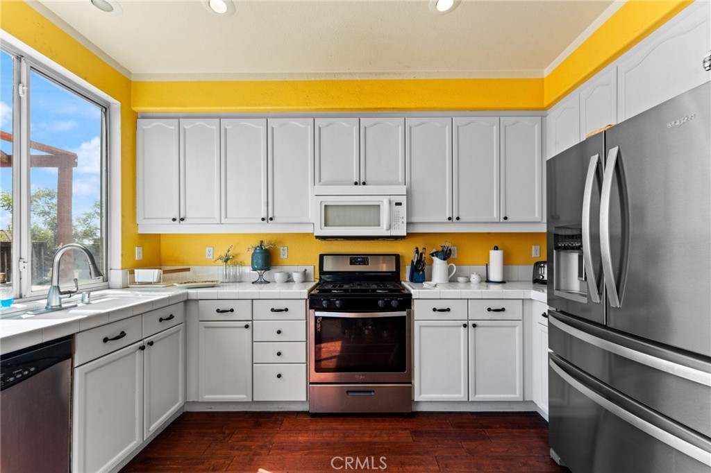 5922 Abernathy Drive Riverside, CA 92507 - Photo 12 of 29 a kitchen with a sink stainless steel appliances and cabinets