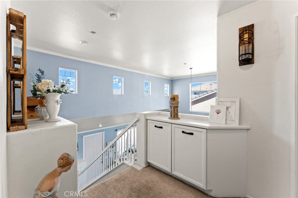 5922 Abernathy Drive Riverside, CA 92507 - Photo 13 of 29 a kitchen with white cabinets and sink