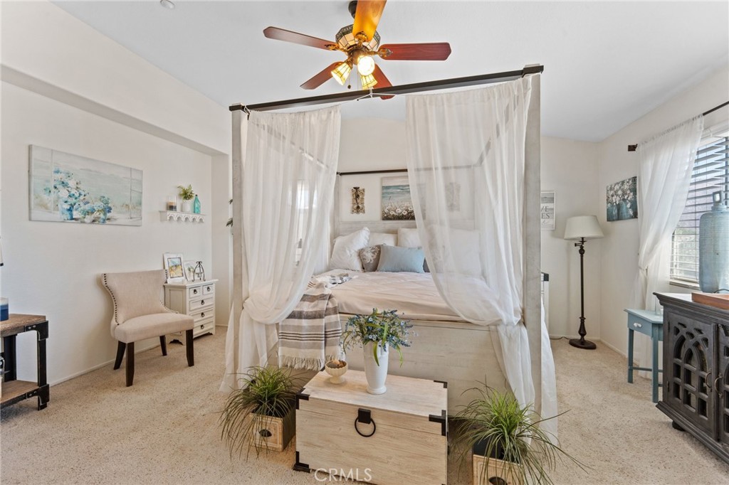 5922 Abernathy Drive Riverside, CA 92507 - Photo 15 of 29 a living room with furniture and a chandelier
