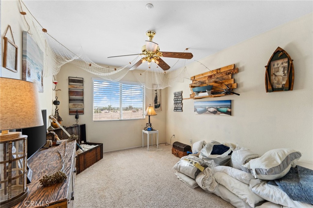 5922 Abernathy Drive Riverside, CA 92507 - Photo 17 of 29 a living room with furniture and a window