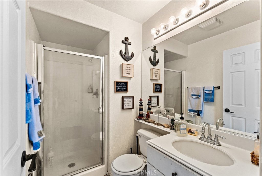 5922 Abernathy Drive Riverside, CA 92507 - Photo 19 of 29 a bathroom with a sink toilet and shower