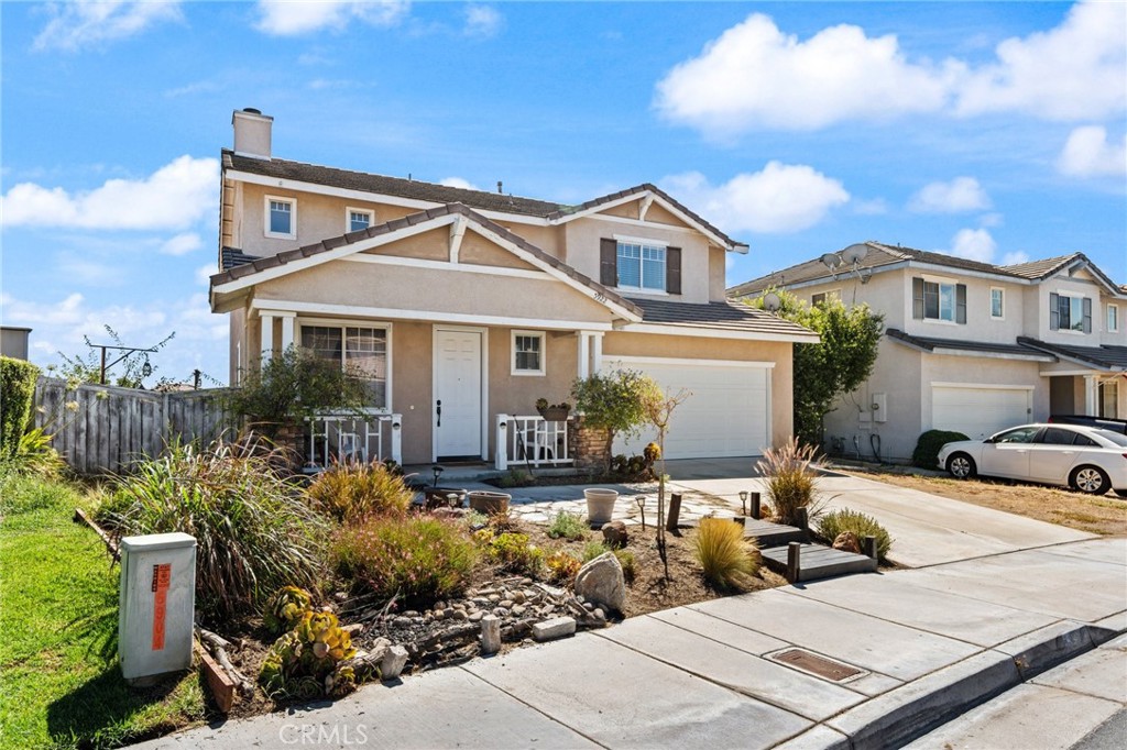 5922 Abernathy Drive Riverside, CA 92507 - Photo 2 of 29 a front view of a house with garden