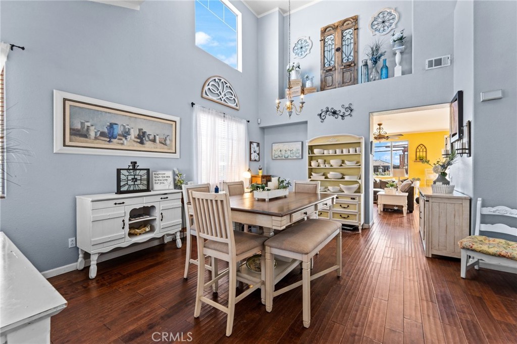 5922 Abernathy Drive Riverside, CA 92507 - Photo 5 of 29 a view of a dining room with furniture and wooden floor