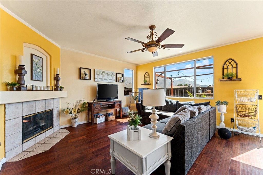 5922 Abernathy Drive Riverside, CA 92507 - Photo 8 of 29 a living room with furniture and a fireplace